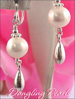 Dangling pearl earrings
