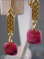 Warm red or pink clip earrings