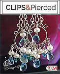 Sparkle and Shine: Gleaming Silver with Blue Topaz Dangle Magic.